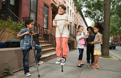 kids playing on pogo sticks