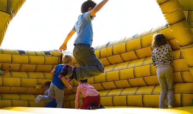 Kids playing on best bounce house
